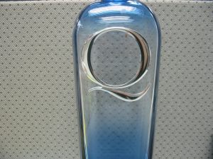 Q Medallion on bottle